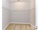Spacious walk-in closet offers ample storage with metal shelving and neutral carpet at 2369 Baxter Se Pl, Concord, NC 28025