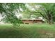 Large backyard features well maintained lawn and mature shade trees at 2412 Wedgewood Dr, Salisbury, NC 28146