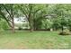 Large and well-maintained backyard with mature trees offering plenty of shade at 2412 Wedgewood Dr, Salisbury, NC 28146