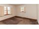 Bedroom with carpeted floors and two windows offering ample light at 2412 Wedgewood Dr, Salisbury, NC 28146