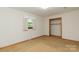 Bedroom featuring carpeted floors, a window, and a closet with storage space at 2412 Wedgewood Dr, Salisbury, NC 28146