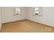 Bedroom featuring carpeted floors and two windows that provide natural light at 2412 Wedgewood Dr, Salisbury, NC 28146