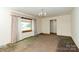 Open living room with a classic chandelier fixture and great natural light at 2412 Wedgewood Dr, Salisbury, NC 28146