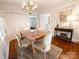 Cozy dining area with hardwood floors, a chandelier, and natural light from a nearby window at 3020 Hampton Ave, Charlotte, NC 28207