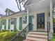 Inviting front entrance with brick steps, a charming porch, and well-maintained landscaping at 3020 Hampton Ave, Charlotte, NC 28207