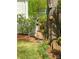 Lush garden with mature trees, decorative elements, and a serene atmosphere at 3020 Hampton Ave, Charlotte, NC 28207