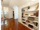 Hallway featuring built-in bookshelves leading to another room at 3020 Hampton Ave, Charlotte, NC 28207