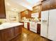 Kitchen featuring white appliances, wooden cabinets, and ample counter space for meal preparation at 3020 Hampton Ave, Charlotte, NC 28207