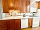 Well-lit kitchen with white appliances, patterned tile backsplash, and hardwood floors at 3020 Hampton Ave, Charlotte, NC 28207
