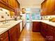 Spacious kitchen with hardwood floors, stainless steel appliances, and backyard view at 3020 Hampton Ave, Charlotte, NC 28207