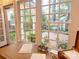 Bright office space featuring large windows offering backyard views with a vintage desk setup at 3020 Hampton Ave, Charlotte, NC 28207