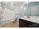 Bathroom with a bathtub, shower with curtain, toilet, and a single sink vanity at 3038 Twin Peaks Ct, Monroe, NC 28110