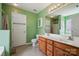 Well-lit bathroom featuring a dual sink vanity, mirror, tile flooring, and neutral colored walls at 3038 Twin Peaks Ct, Monroe, NC 28110