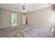 Neutral Primary bedroom with carpet, ceiling fan, and access to a private bath at 3038 Twin Peaks Ct, Monroe, NC 28110