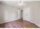 Bedroom featuring hardwood floors, two closets, and a ceiling fan at 3038 Twin Peaks Ct, Monroe, NC 28110