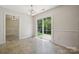 Bright dining space with sliding glass door and access to adjacent rooms at 3038 Twin Peaks Ct, Monroe, NC 28110