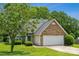 Attractive home with brick and siding, featuring a two-car garage and lush green lawn at 3038 Twin Peaks Ct, Monroe, NC 28110