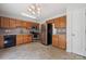 Functional kitchen featuring stainless steel appliances, wood cabinets, and tile flooring at 3038 Twin Peaks Ct, Monroe, NC 28110