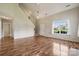 Inviting living room with wood floors, lots of natural light, and open floorplan at 3038 Twin Peaks Ct, Monroe, NC 28110