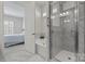 Elegant bathroom boasts a glass shower and soaking tub at 329 Brambling Ct, Monroe, NC 28110