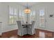 Dining area with round table, four chairs, and views from multiple windows at 329 Brambling Ct, Monroe, NC 28110
