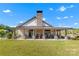 New construction boasting a spacious covered porch with rocking chairs, ideal for relaxing and enjoying the peaceful surroundings at 329 Brambling Ct, Monroe, NC 28110
