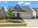 Charming single-story home with a two-car garage, manicured lawn and attractive landscaping, located in a desirable community at 329 Brambling Ct, Monroe, NC 28110