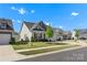 Attractive single-story home with a well-manicured front lawn and a convenient two-car garage at 329 Brambling Ct, Monroe, NC 28110