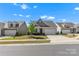 Charming single-story home with manicured lawn and two-car garage, perfect for suburban living at 329 Brambling Ct, Monroe, NC 28110