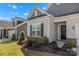 Close-up of a lovely home's front entrance with manicured landscaping and a well-kept lawn at 329 Brambling Ct, Monroe, NC 28110