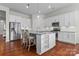 Bright kitchen features stainless steel appliances, a granite island with seating and storage at 329 Brambling Ct, Monroe, NC 28110