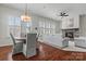 Open-concept living space with a fireplace, dining area, and natural light at 329 Brambling Ct, Monroe, NC 28110
