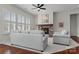 Cozy living room featuring a fireplace, two sofas, and large windows for natural light at 329 Brambling Ct, Monroe, NC 28110