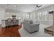 Open concept living area with a fireplace, kitchen, dining, and natural light at 329 Brambling Ct, Monroe, NC 28110