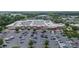 Aerial view of Target with shopping center, parking lot and landscaping, and neighborhood in the background at 329 Brambling Ct, Wesley Chapel, NC 28110
