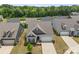 An aerial view showcases a well-maintained home with a manicured lawn in a desirable neighborhood at 329 Brambling Ct, Wesley Chapel, NC 28110