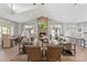 Open-concept clubhouse living room with comfortable seating, a fireplace, and a TV at 329 Brambling Ct, Wesley Chapel, NC 28110