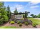 Pinnacle at Wesley Chapel community sign with beautiful landscaping and stone pillar base at 329 Brambling Ct, Wesley Chapel, NC 28110