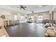 A spacious gym with black rubber flooring has many workout machines and tools at 329 Brambling Ct, Wesley Chapel, NC 28110