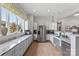 Bright kitchen featuring white cabinets, stainless steel appliances, and ample counter space at 329 Brambling Ct, Wesley Chapel, NC 28110