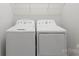 Close-up of white front-loading washer and dryer with easy to use controls at 329 Brambling Ct, Wesley Chapel, NC 28110