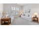 Cozy living room with neutral tones, shuttered windows and comfortable seating at 329 Brambling Ct, Wesley Chapel, NC 28110