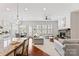 Bright, open-concept living space featuring hardwood floors, a fireplace, and granite countertops at 329 Brambling Ct, Wesley Chapel, NC 28110