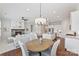 Open floor plan showcasing the dining, kitchen, and living area, perfect for entertaining and everyday living with a fireplace at 329 Brambling Ct, Wesley Chapel, NC 28110