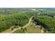 Scenic aerial view of the property surrounded by dense trees and foliage, highlighting the quiet location at 351 Fletcher Rd, Union Grove, NC 28689