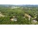 Expansive aerial view showcasing lush green surroundings and highlighting the property's location in a serene, wooded area at 351 Fletcher Rd, Union Grove, NC 28689