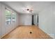 Empty bedroom with laminate floors, large windows for natural light, and neutral walls at 351 Fletcher Rd, Union Grove, NC 28689