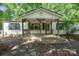 Charming single-story home with a covered front porch and stone landscaping at 351 Fletcher Rd, Union Grove, NC 28689