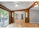 Living area with laminate wood floors, natural light, and wood paneled accent walls at 351 Fletcher Rd, Union Grove, NC 28689