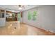 Large living space offering natural light, wood floors, and a view to the kitchen at 351 Fletcher Rd, Union Grove, NC 28689
